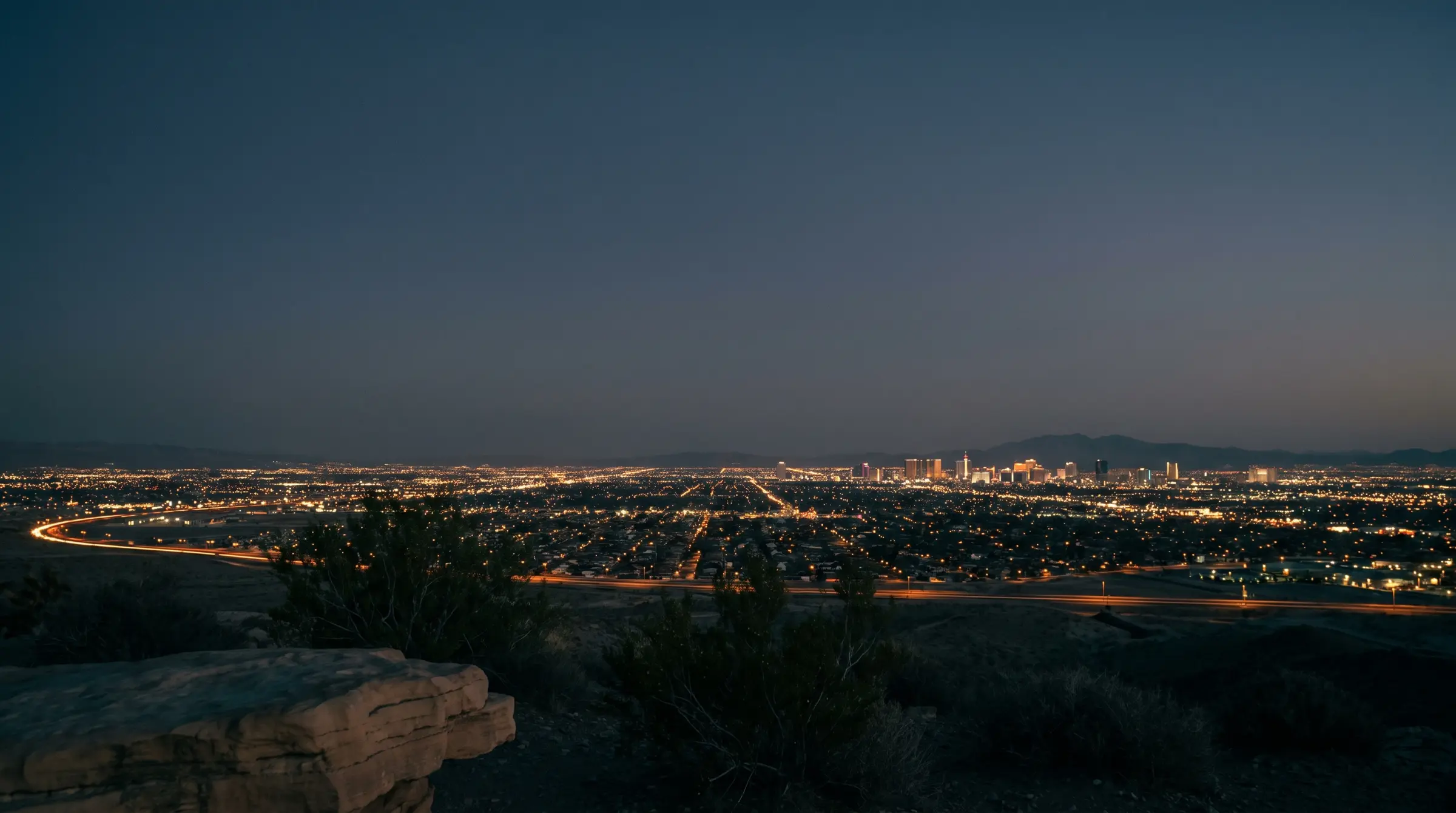 The Las Vegas valley at blue hour, seen from the foothills above Summerlin